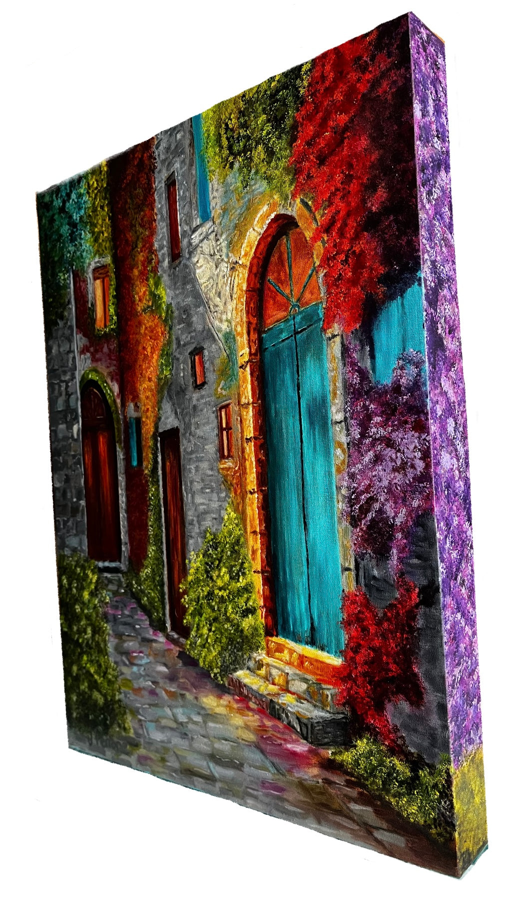 Canvas print of a colorful street scene with a blue door and flowers.